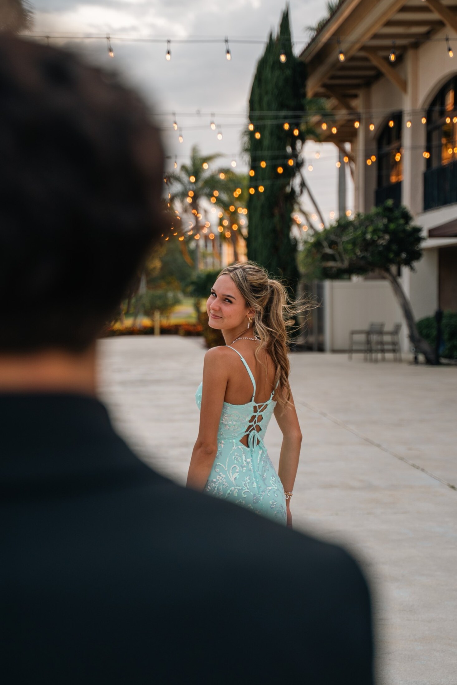 A first look under string lights before the formal