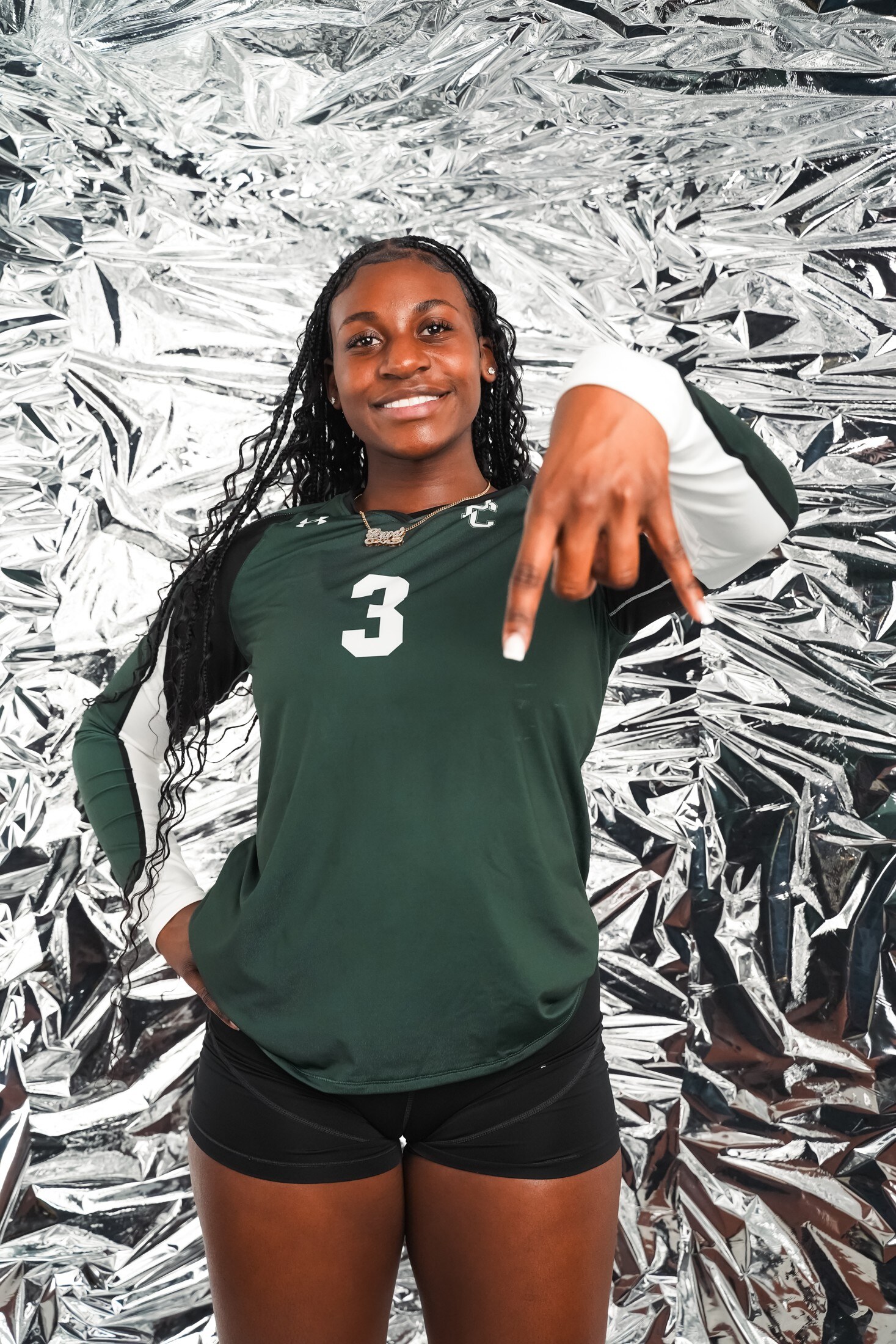Athlete portrait against a crinkled foil backdrop