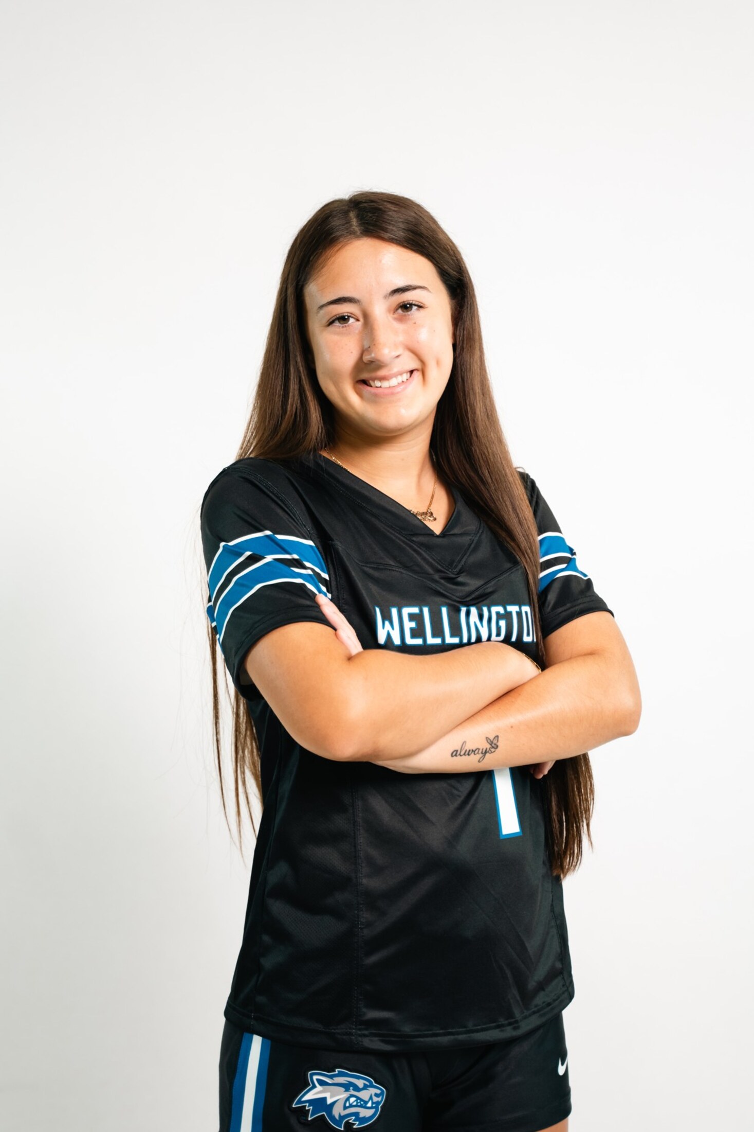 Media day portrait, arms crossed on white