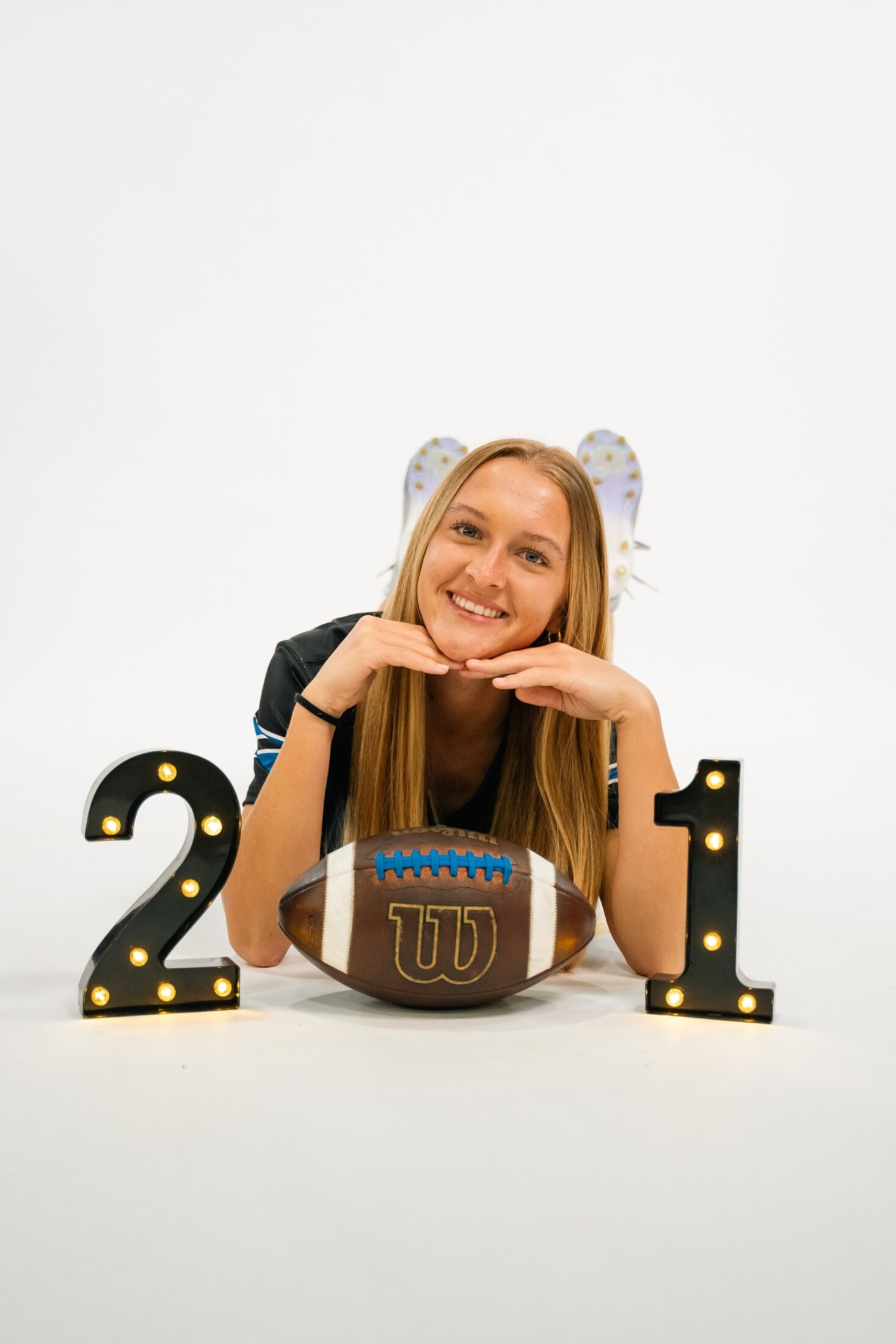 Studio portrait with a football and year numbers