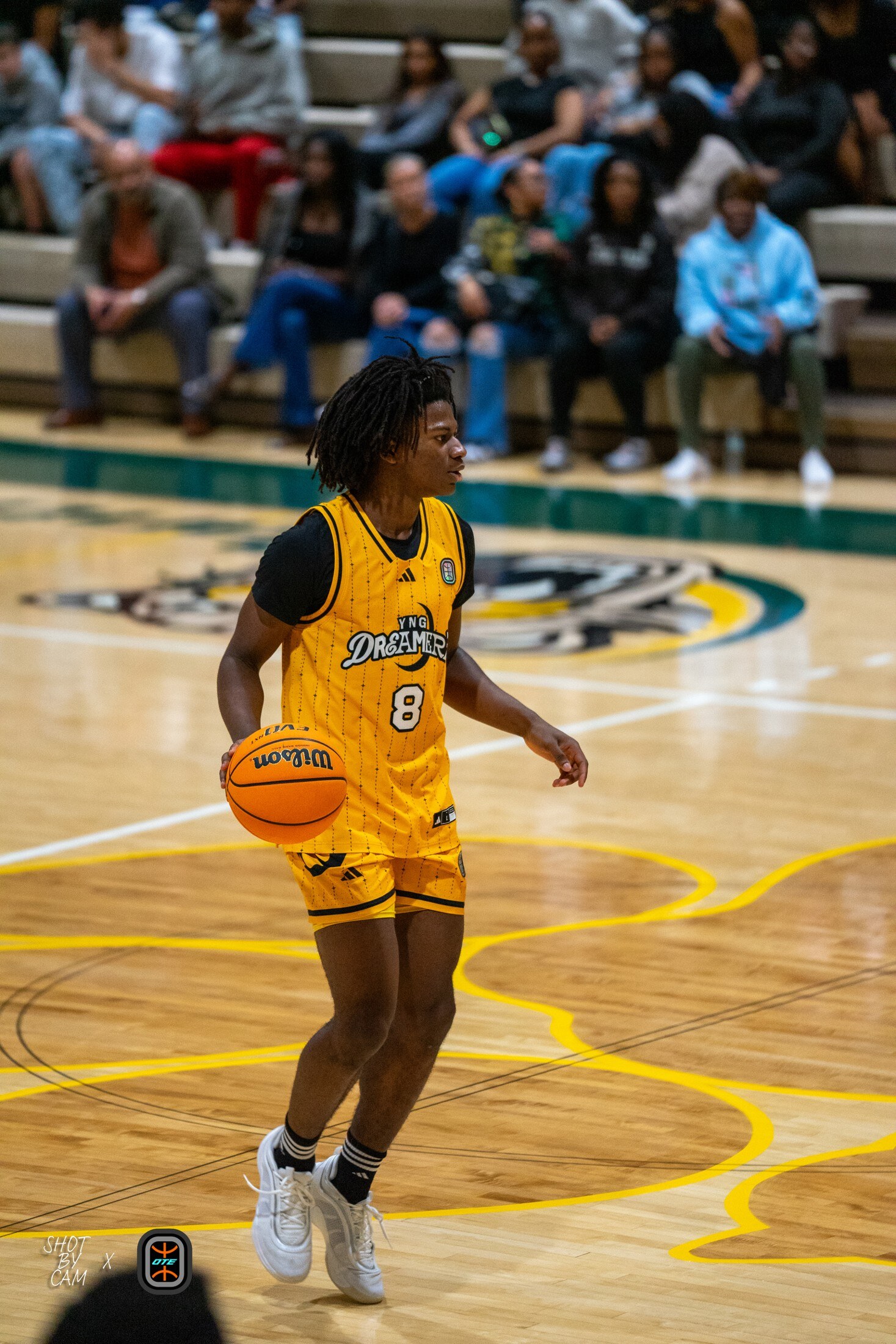 Basketball player bringing the ball up the court