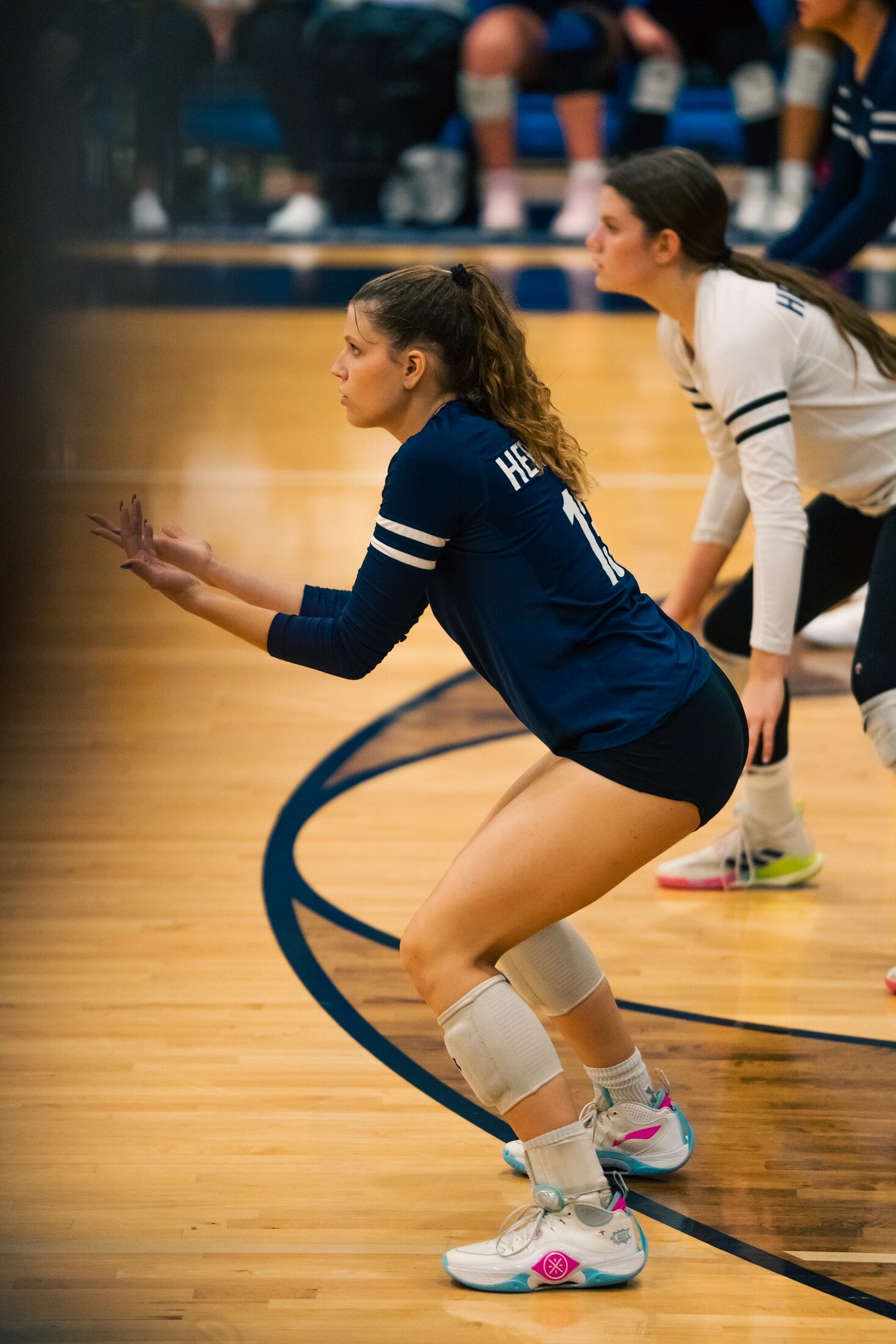 Volleyball player in ready position on defense