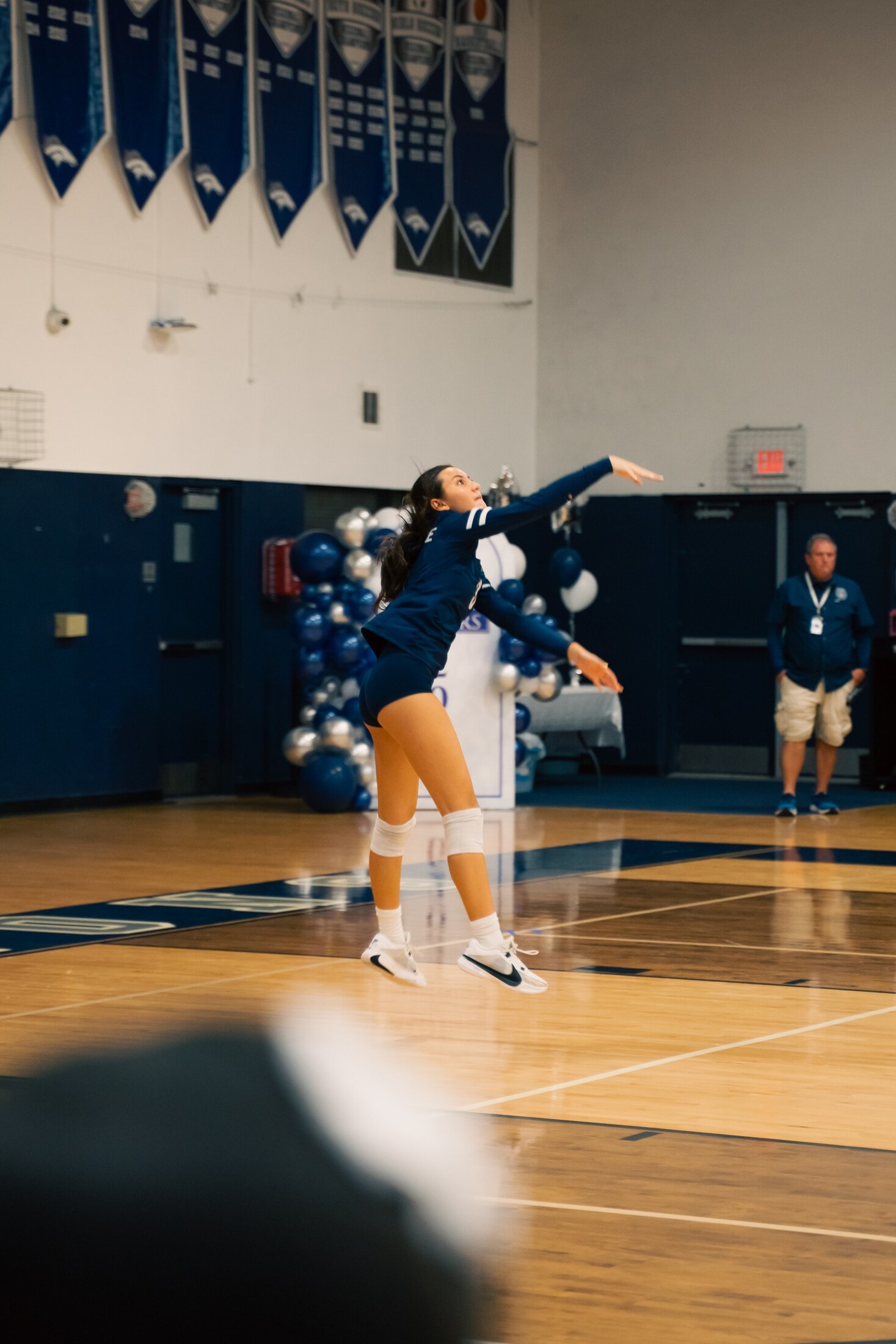 Volleyball match in a full gym