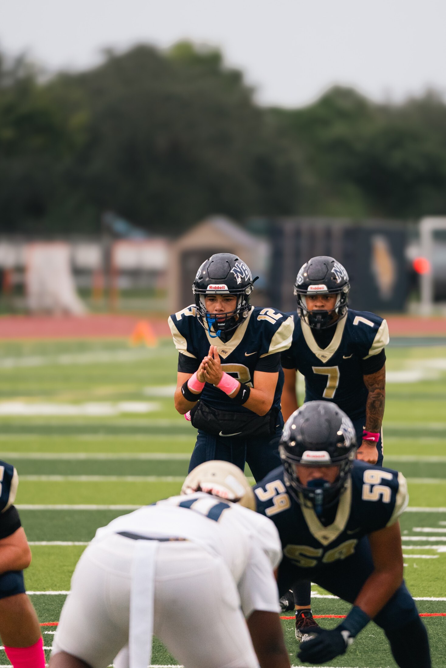 Football players regrouping between plays