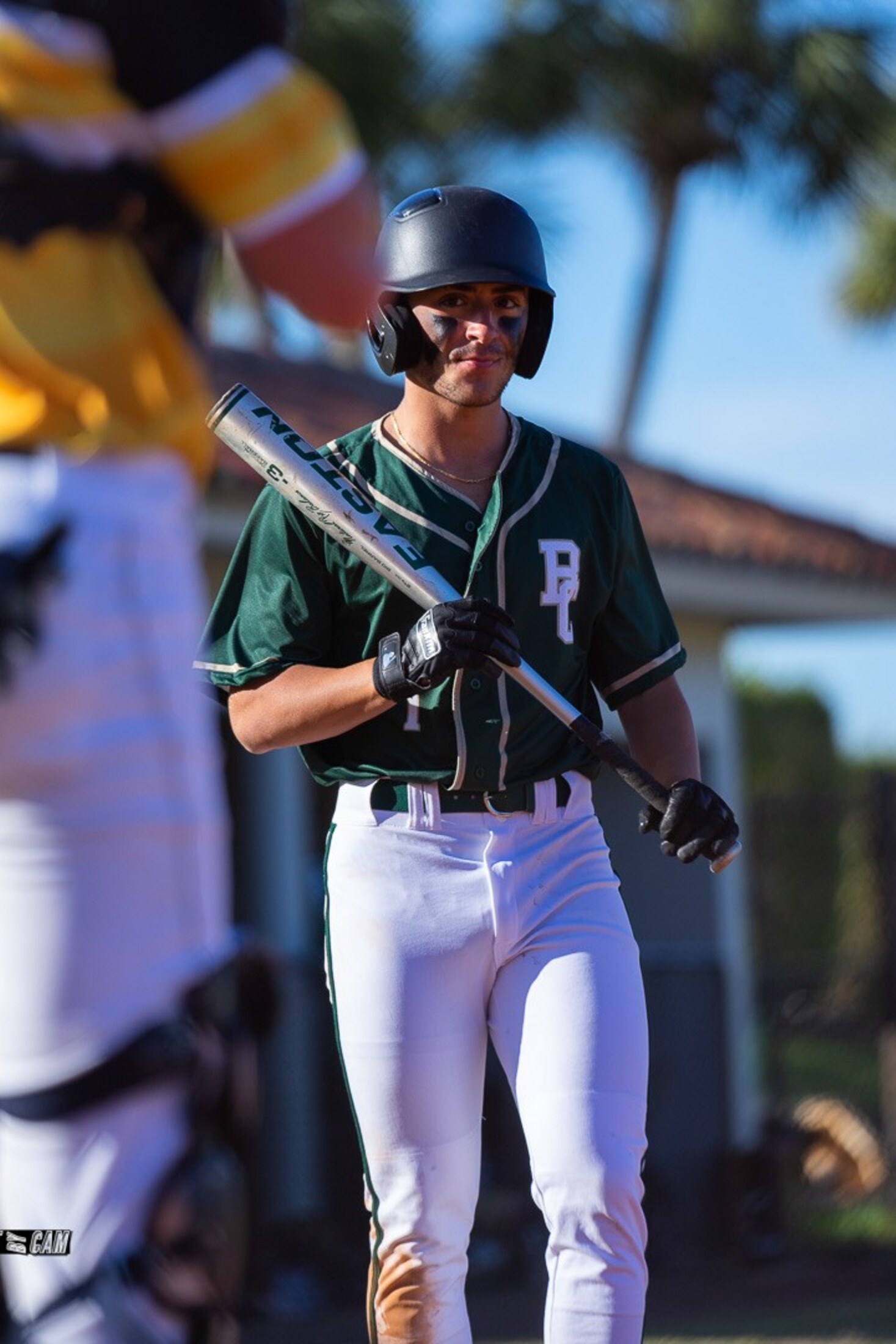 Baseball player with his bat before the game