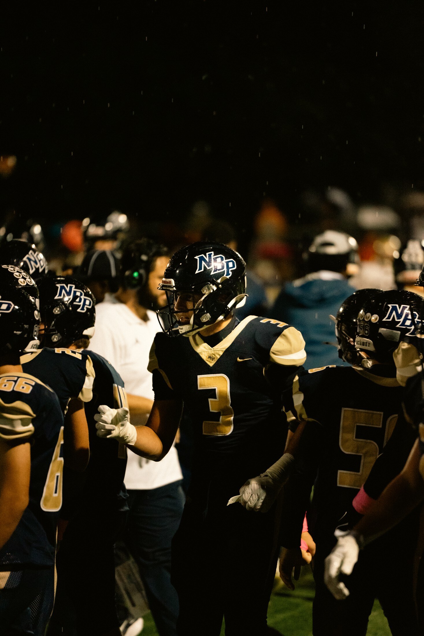 Football players gathering before kickoff