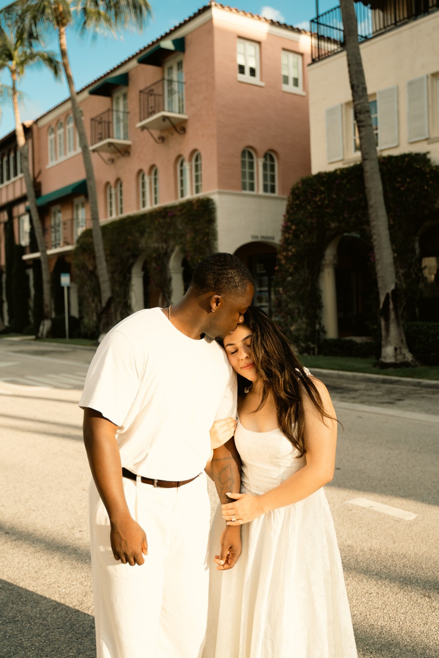 Bride and groom crossing a downtown street