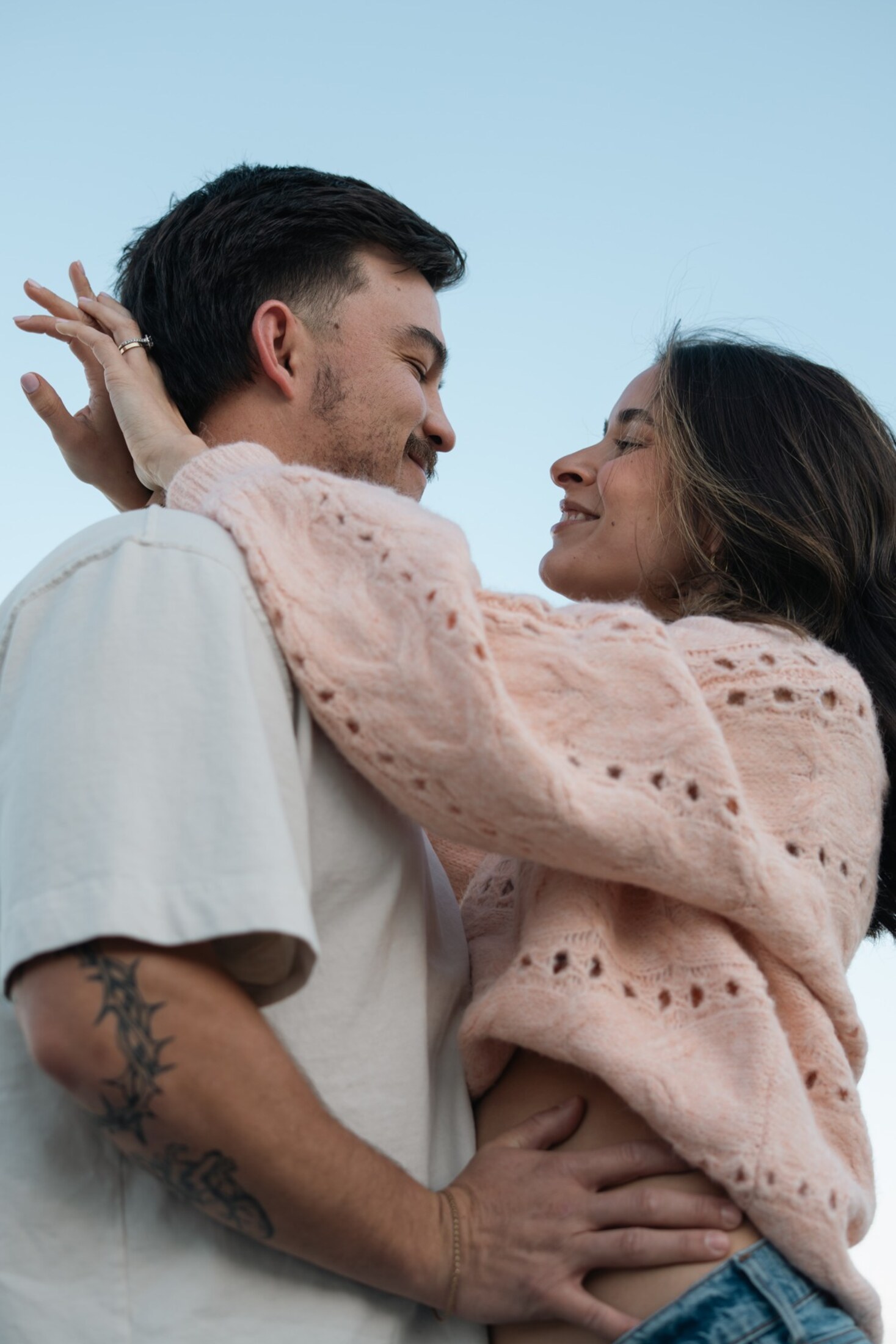 Couple wrapped up together outdoors